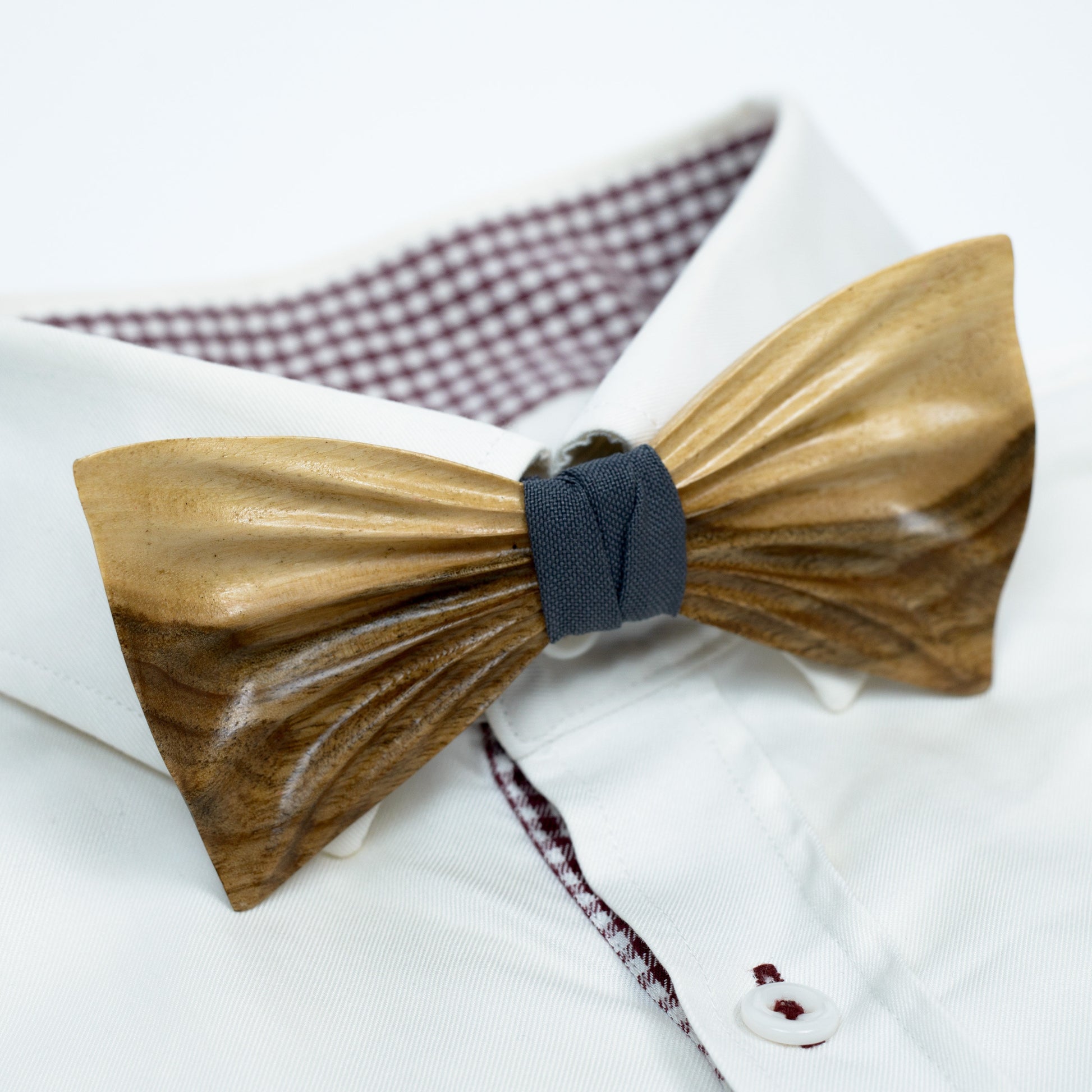 Groomsmen bow tie set with personalized cufflinks and a pocket square in a sleek presentation box.