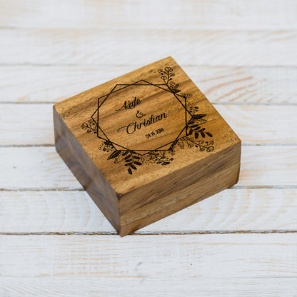Close-up of laser engraved text on wooden ring box