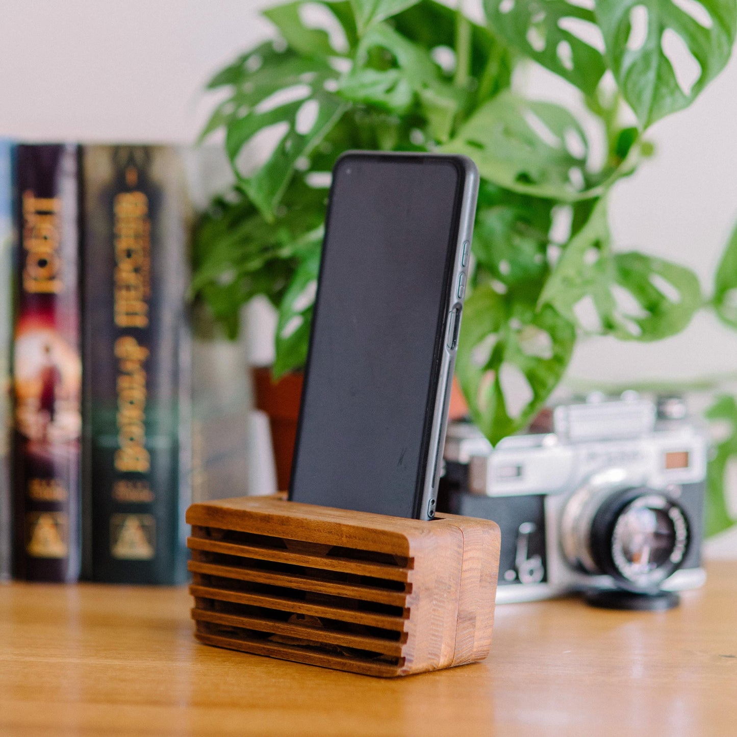 Rustic wooden phone speaker and stand, perfect office desk accessory and corporate gift.