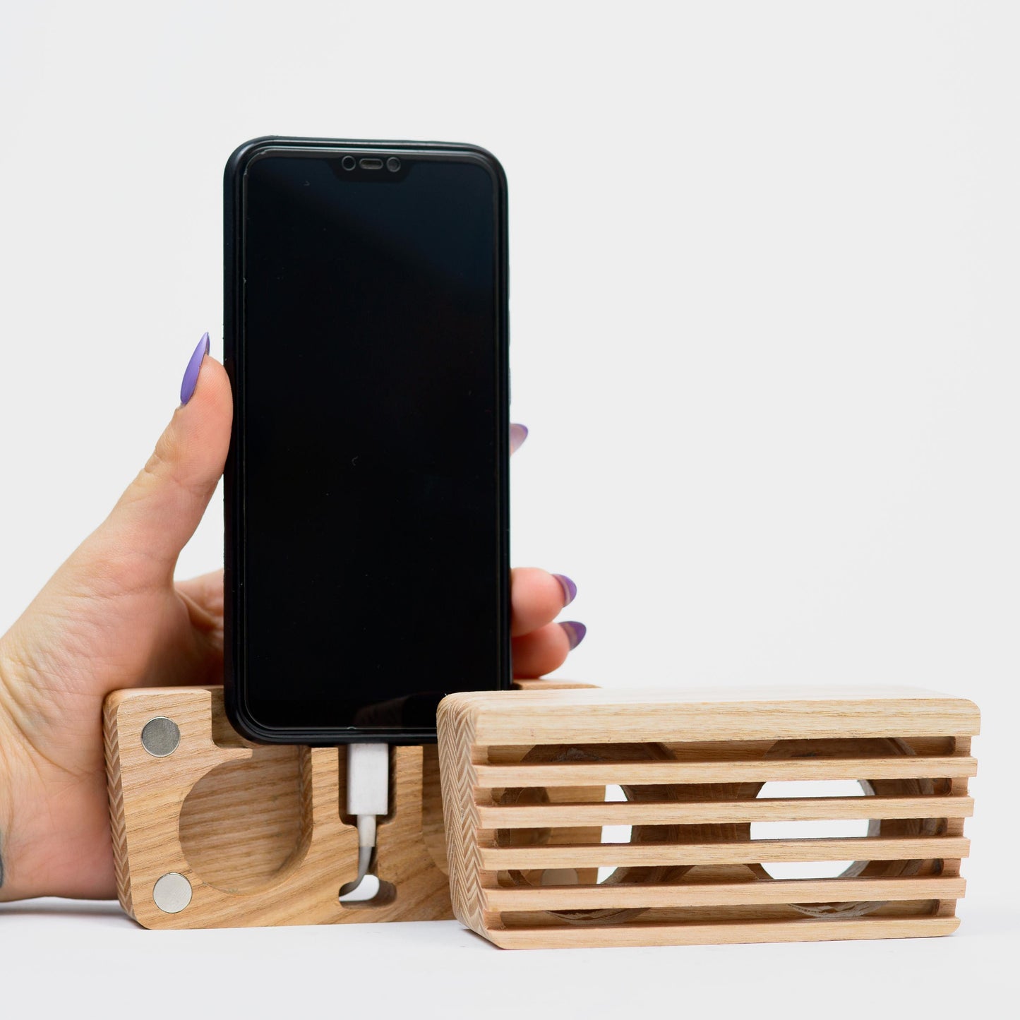 Compact wooden sound amplifier for smartphones, handcrafted and eco-friendly design.