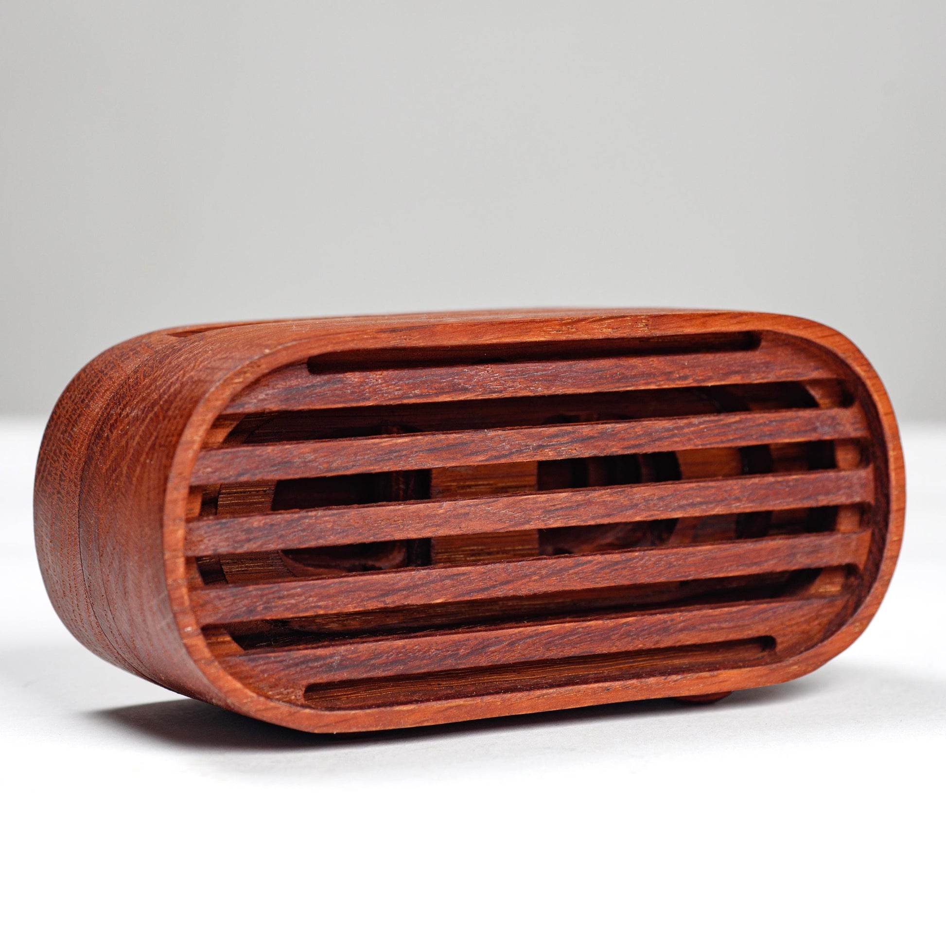 Compact wooden phone speaker with amplifier effect, perfect desk organizer and gift.