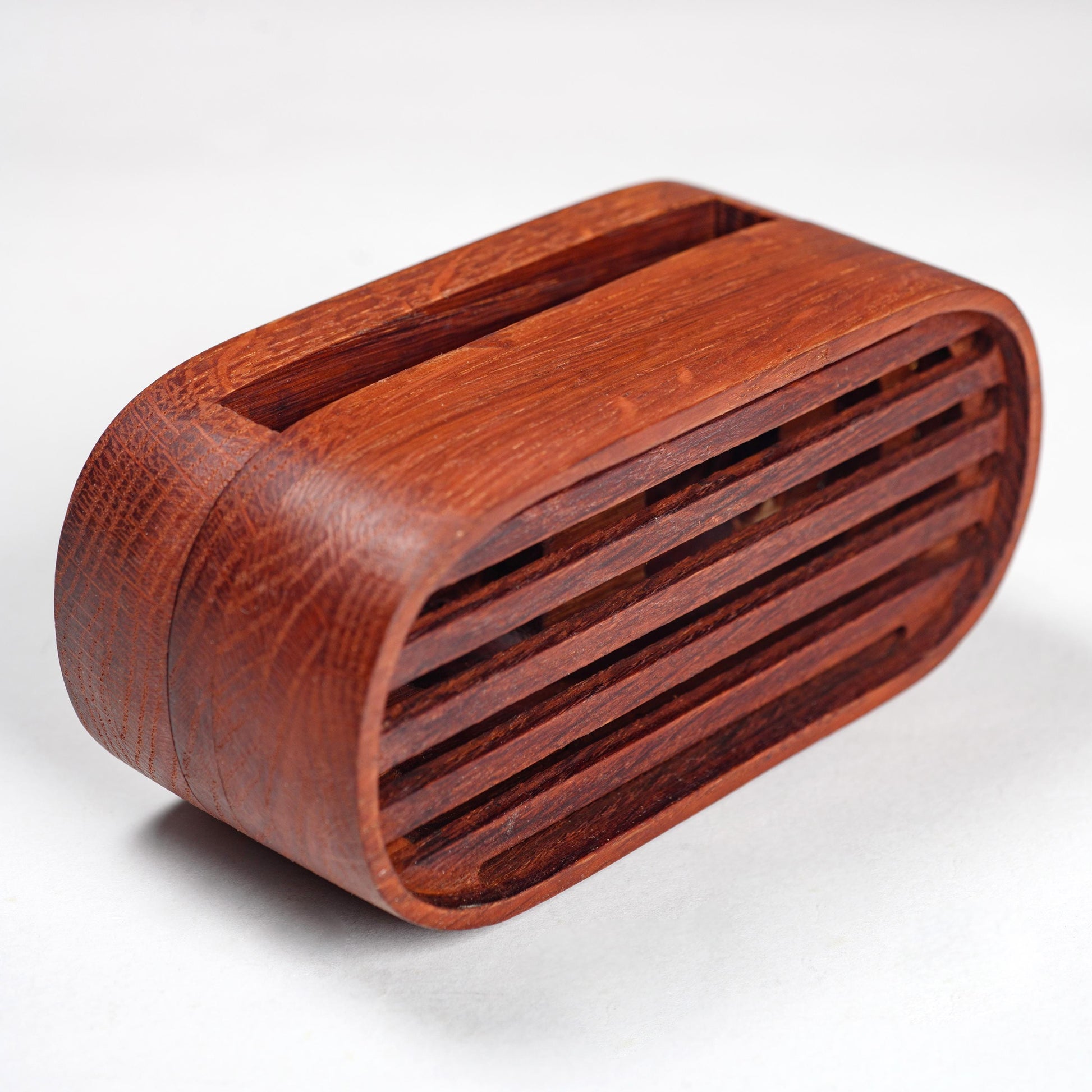 Compact wooden phone speaker with amplifier effect, perfect desk organizer and gift.