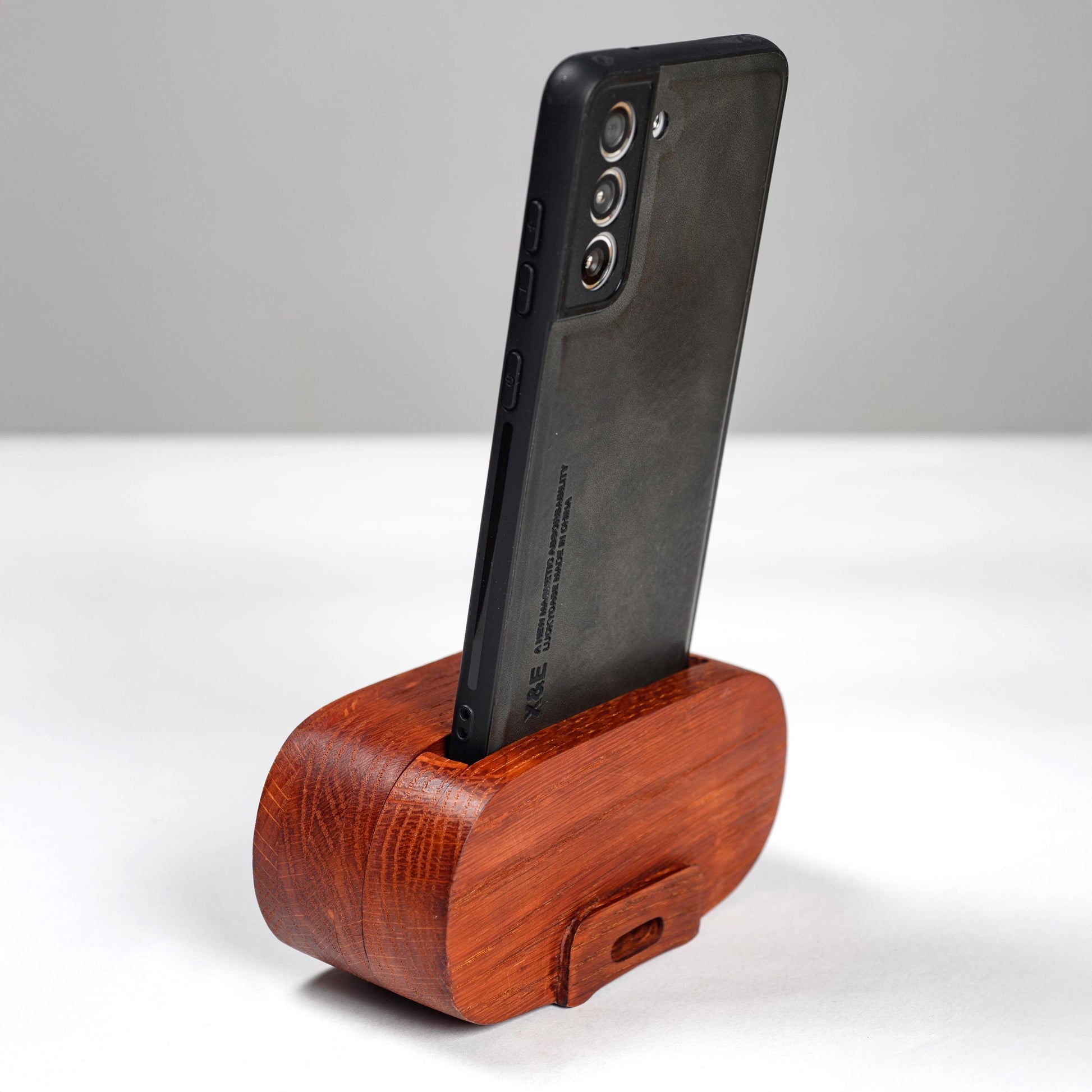 Compact wooden phone speaker with amplifier effect, perfect desk organizer and gift.
