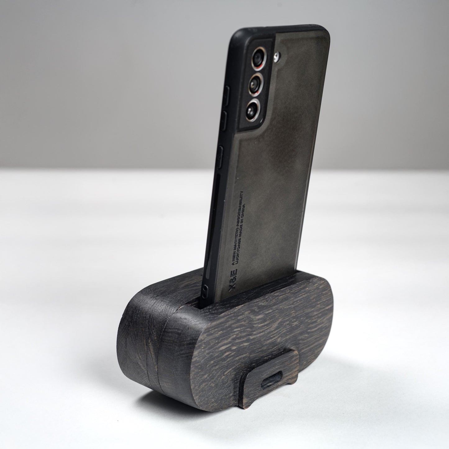 Compact wooden phone speaker with amplifier effect, perfect desk organizer and gift.