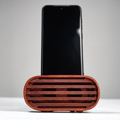 Oak wood phone stand with passive amplifier, boosts sound naturally, fits iPhone and Android.