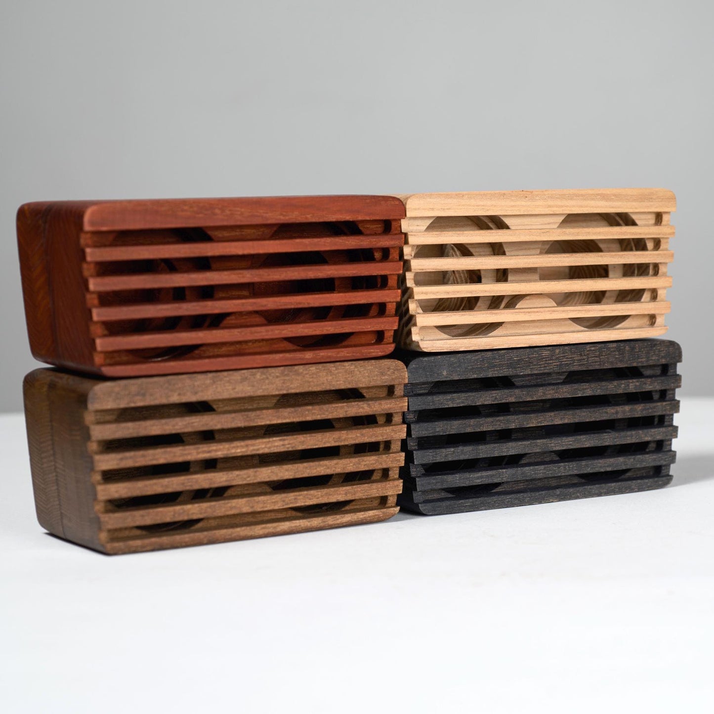 Compact wooden sound amplifier for smartphones, handcrafted and eco-friendly design.