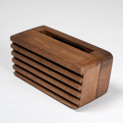 Compact wooden sound amplifier for smartphones, handcrafted and eco-friendly design.