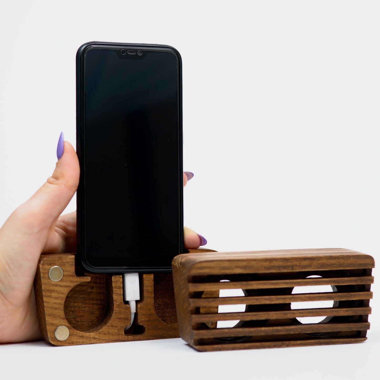 Compact wooden sound amplifier for smartphones, handcrafted and eco-friendly design.