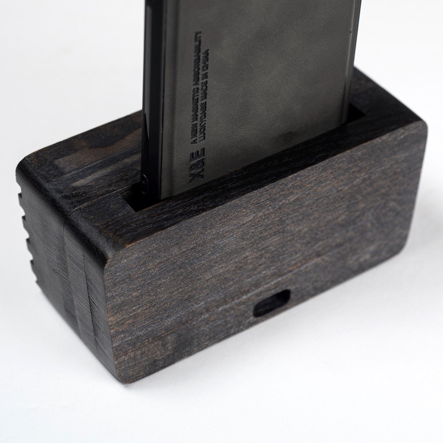 Compact wooden sound amplifier for smartphones, handcrafted and eco-friendly design.