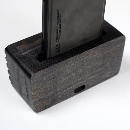 Compact wooden sound amplifier for smartphones, handcrafted and eco-friendly design.