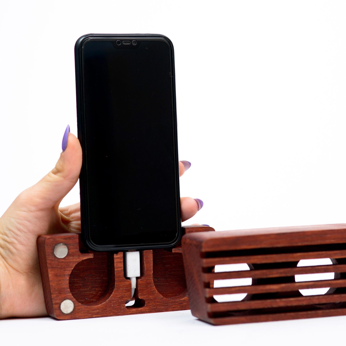Compact wooden sound amplifier for smartphones, handcrafted and eco-friendly design.
