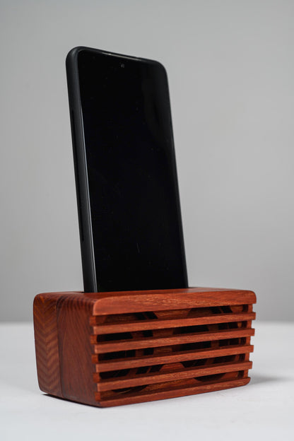 Ash wood phone stand with passive amplifier, doubles as a charging station and desk organizer.