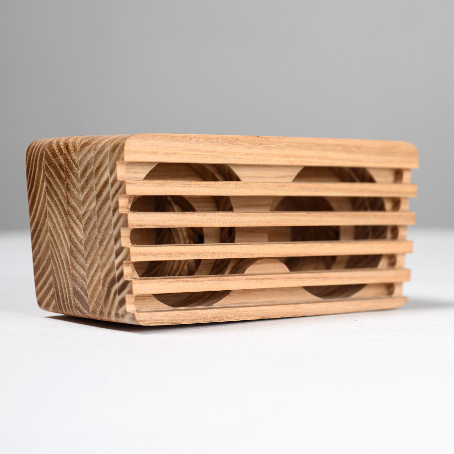 Rustic wooden phone speaker and stand, perfect office desk accessory and corporate gift.