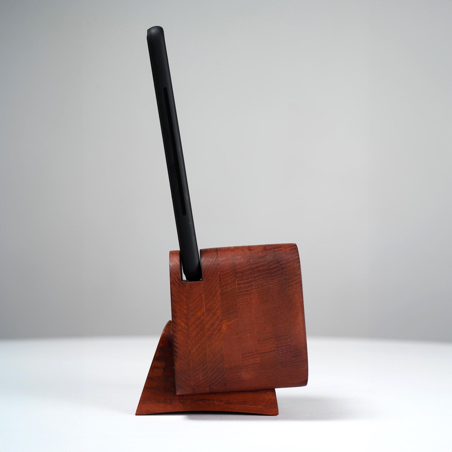 Stylish desk accessory and docking station for any smartphone.