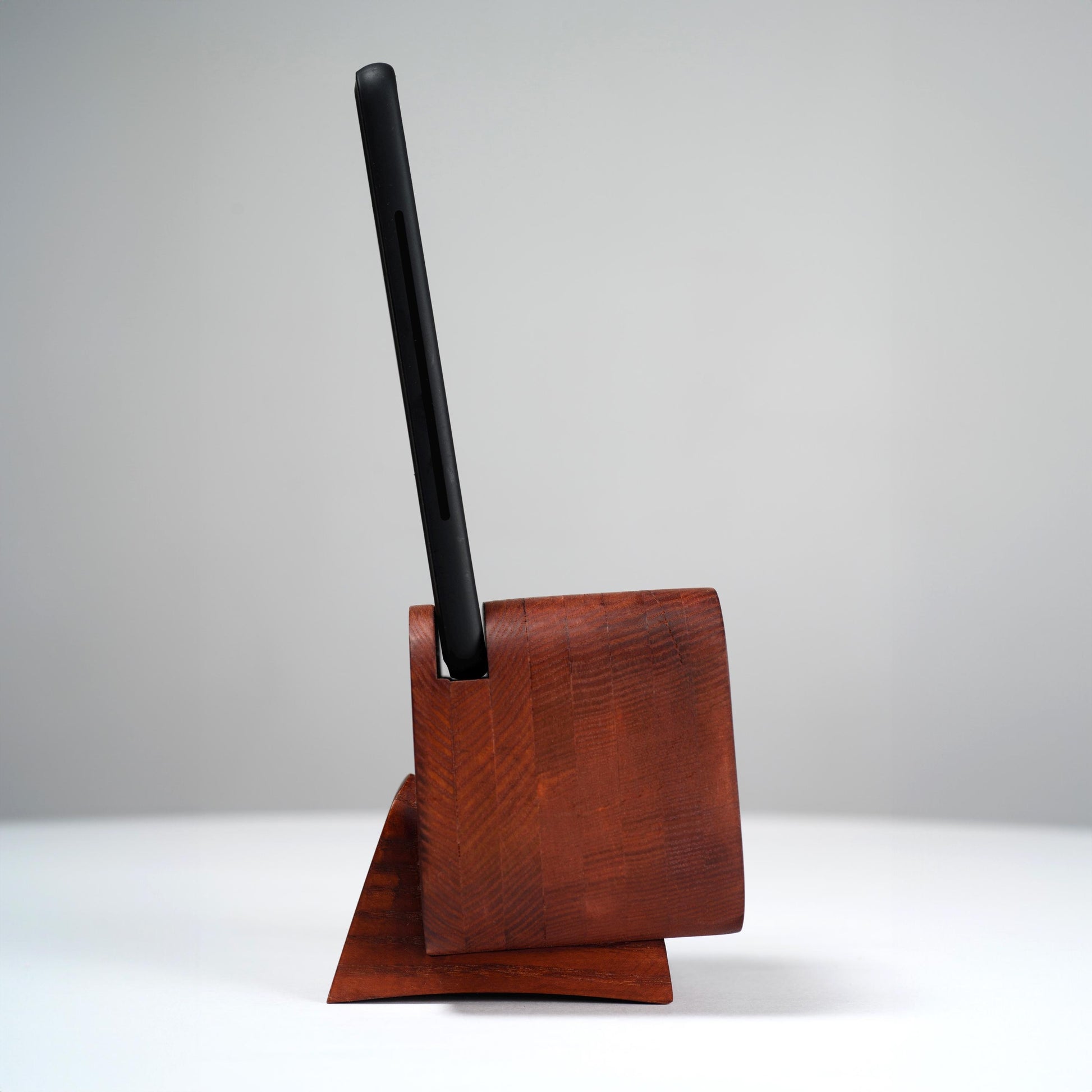 Stylish desk accessory and docking station for any smartphone.