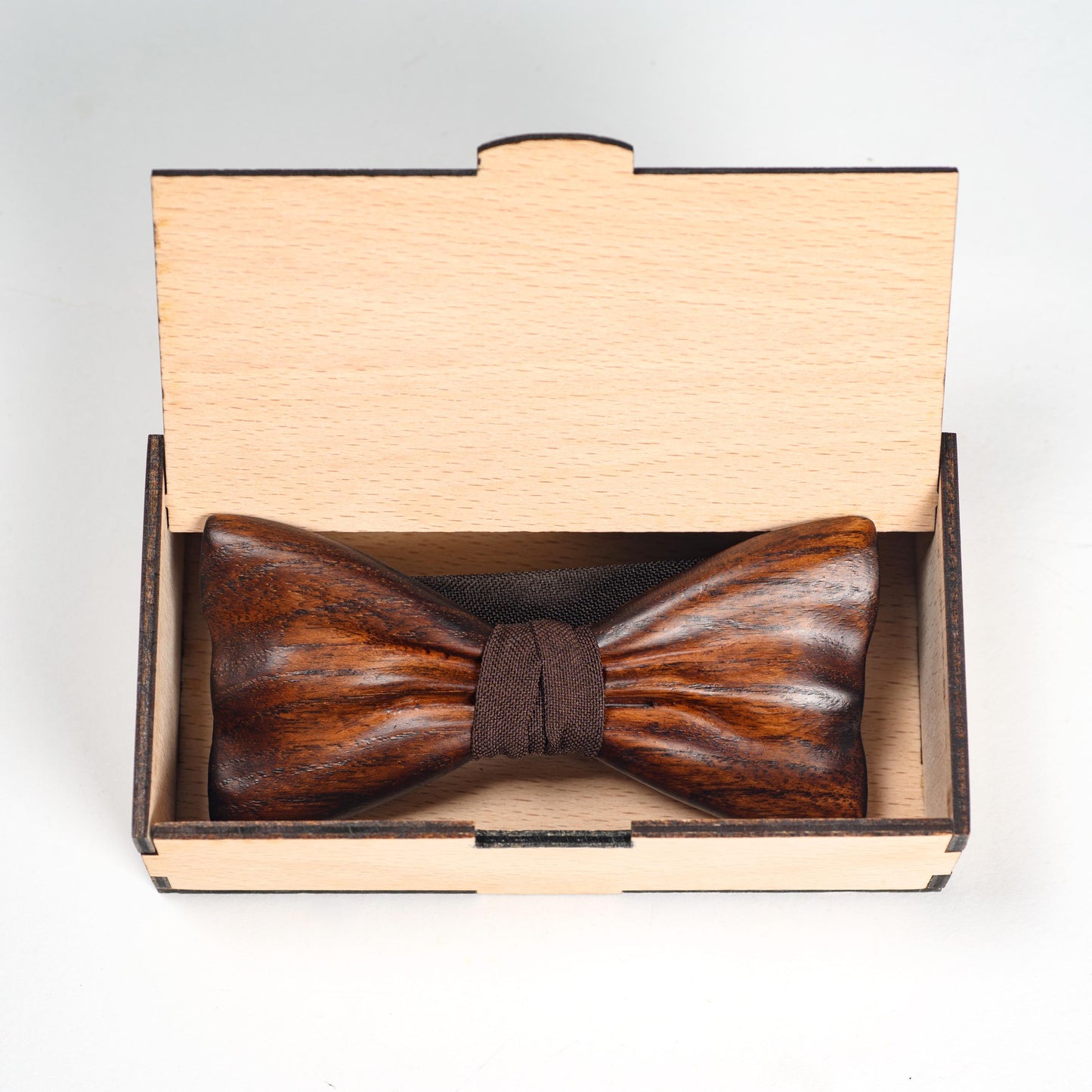 Wood bow tie inside wooden gift box