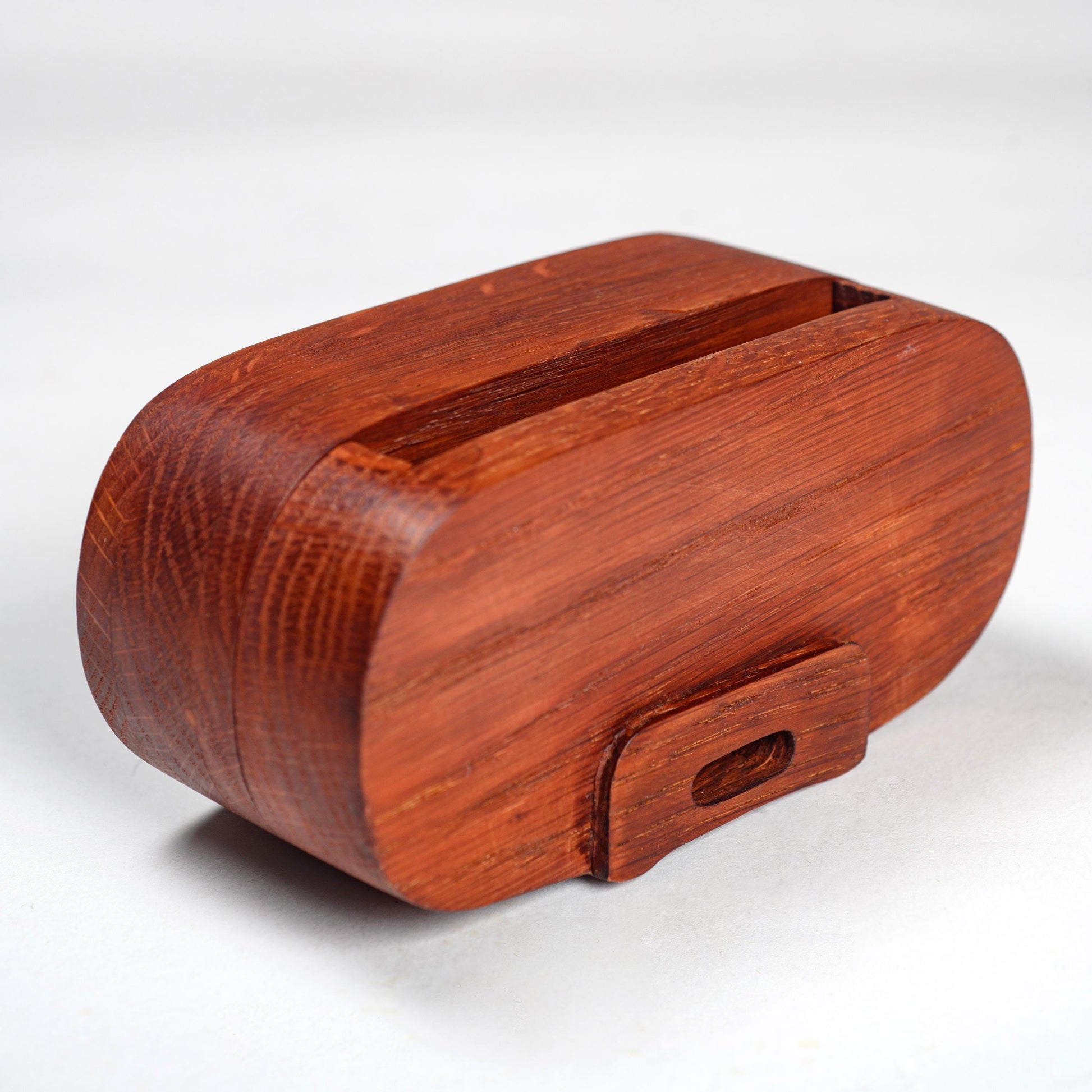 Compact wooden phone speaker with amplifier effect, perfect desk organizer and gift.
