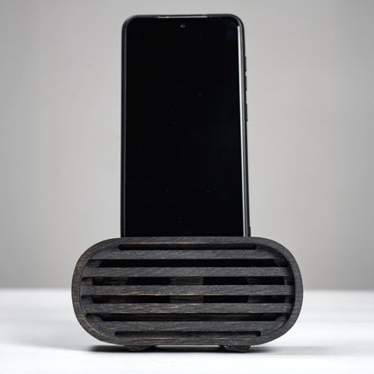Oak wood phone stand with passive amplifier, boosts sound naturally, fits iPhone and Android.