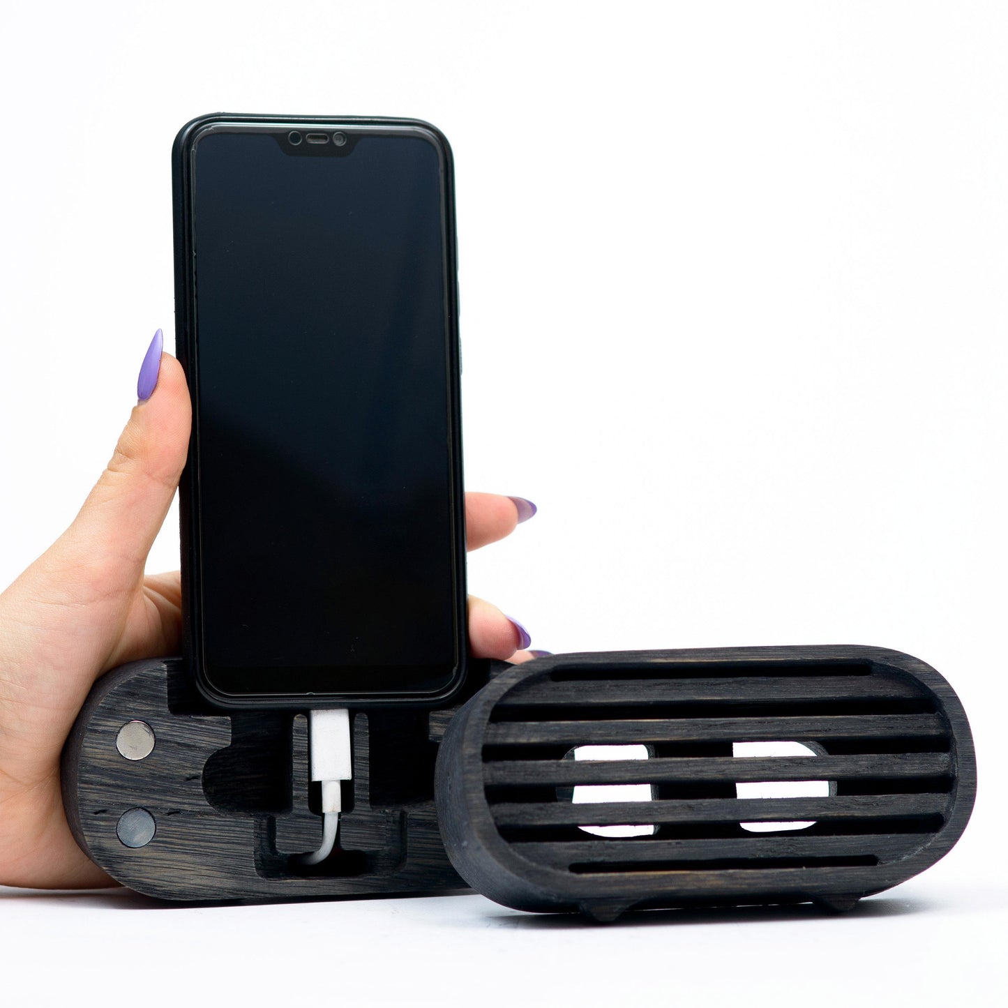 Rustic wooden phone speaker in home office, eco-friendly sound amplifier for music lovers.