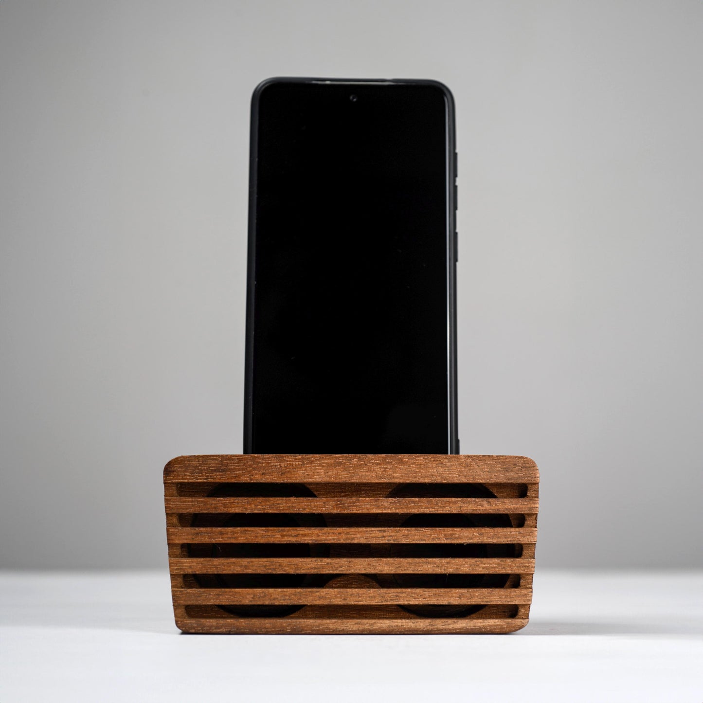 Ash wood phone stand with passive amplifier, doubles as a charging station and desk organizer.