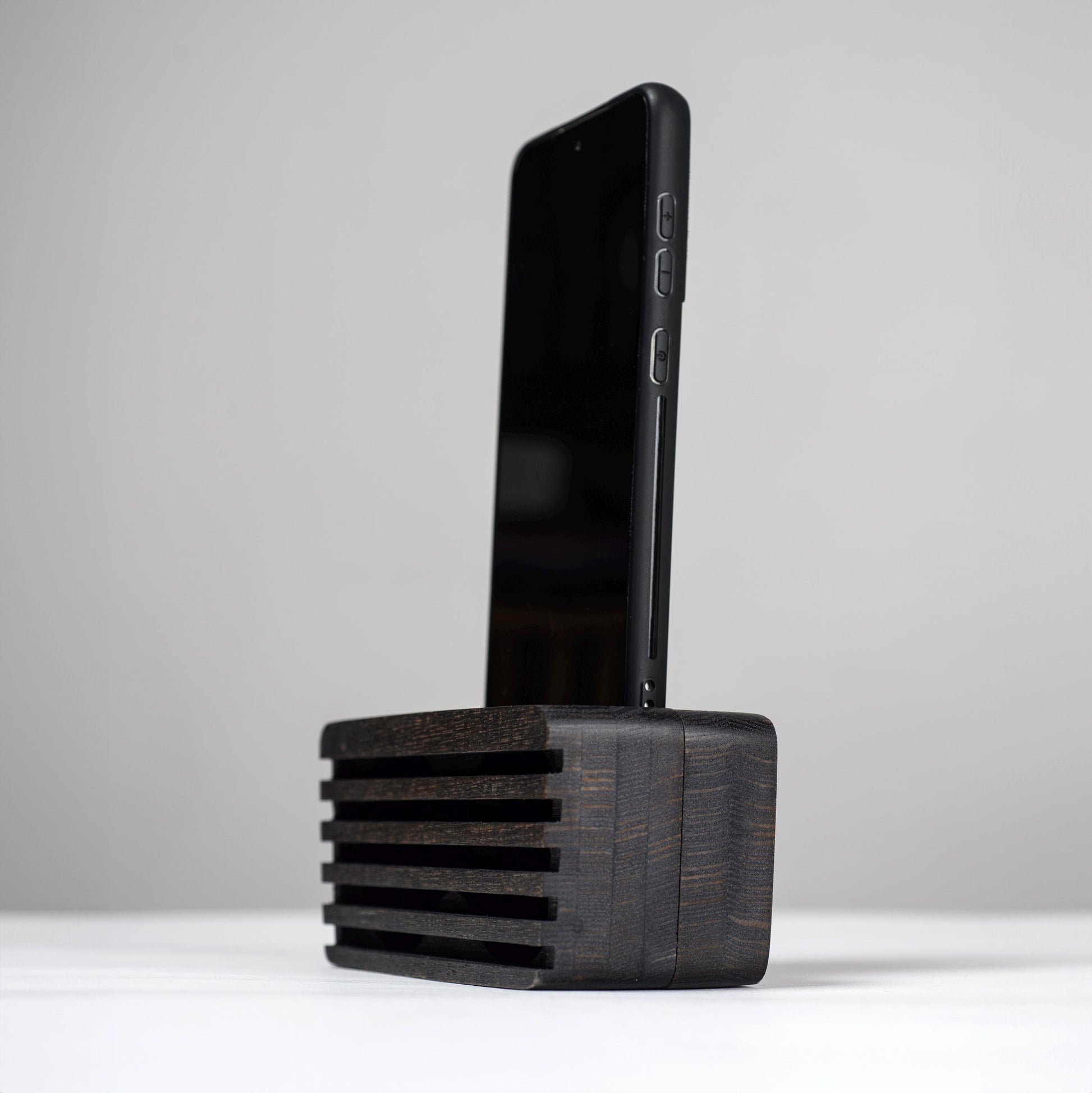Ash wood phone stand with passive amplifier, doubles as a charging station and desk organizer.