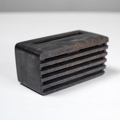 Compact wooden sound amplifier for smartphones, handcrafted and eco-friendly design.