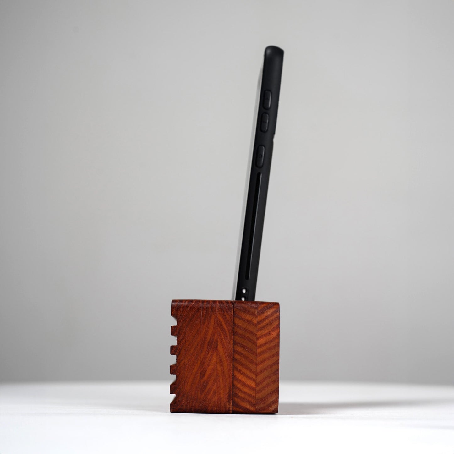 Compact wooden sound amplifier for smartphones, handcrafted and eco-friendly design.