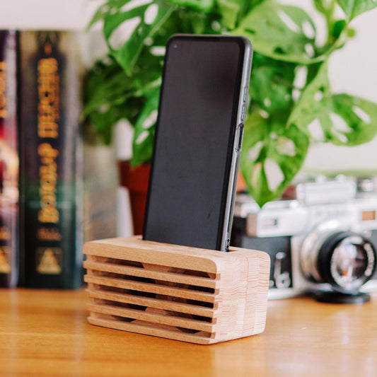 Rustic wooden phone speaker and stand, perfect office desk accessory and corporate gift.