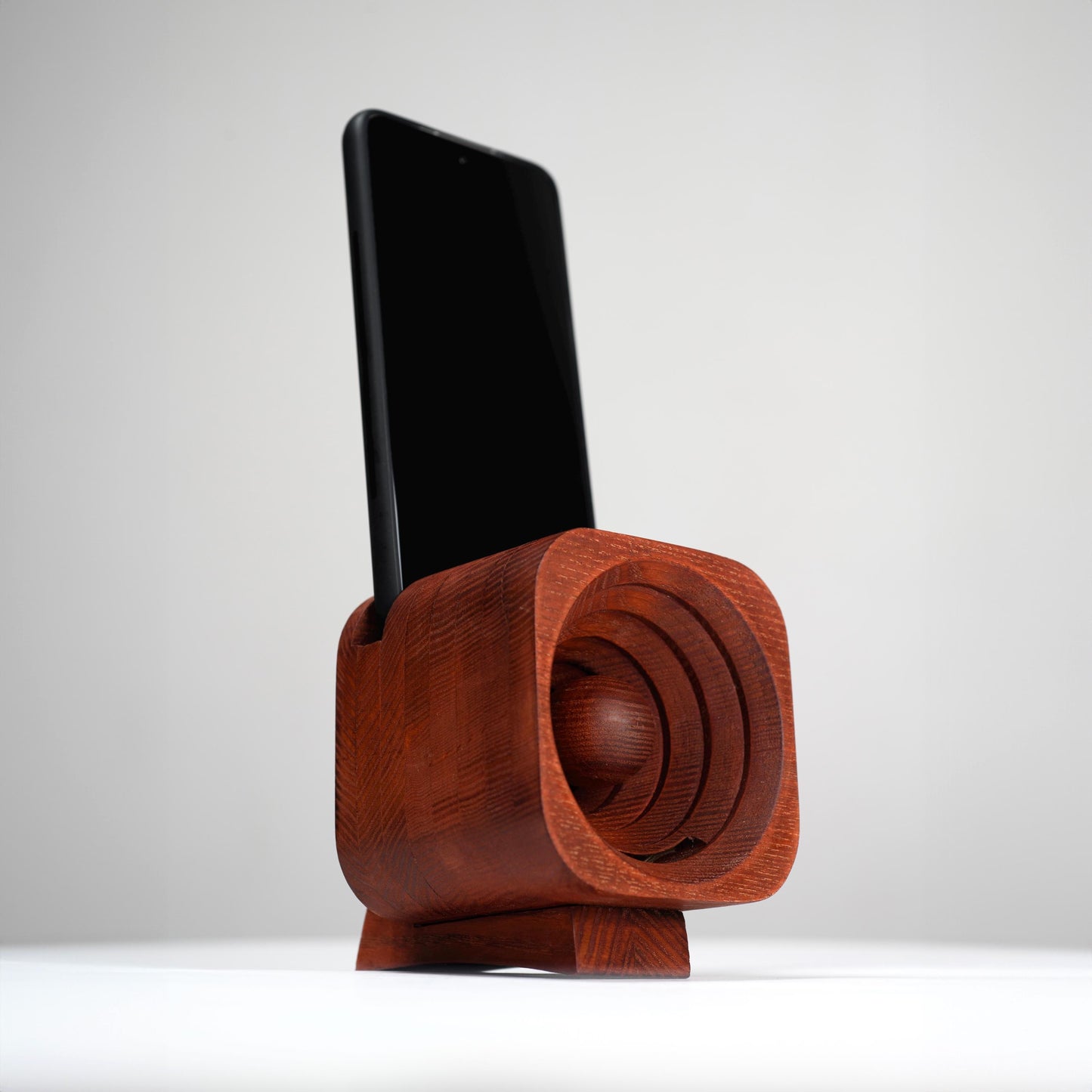 Elegant wooden phone stand, perfect for desk organization.