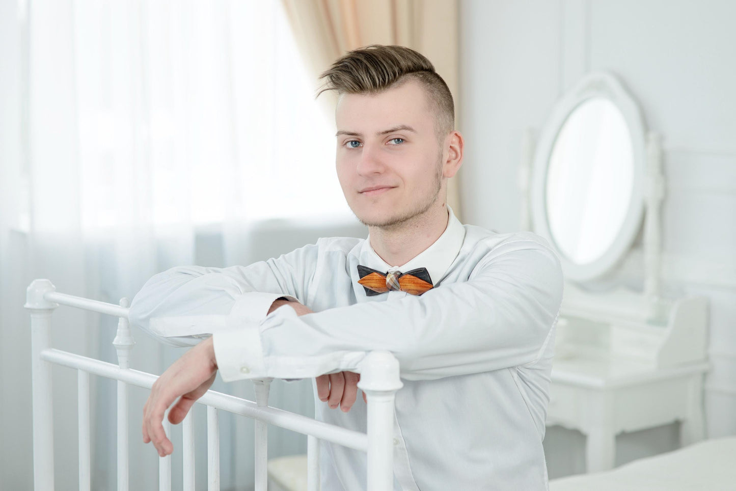 Close-up of a personalized wooden bow tie, perfect for groomsmen or special occasions.