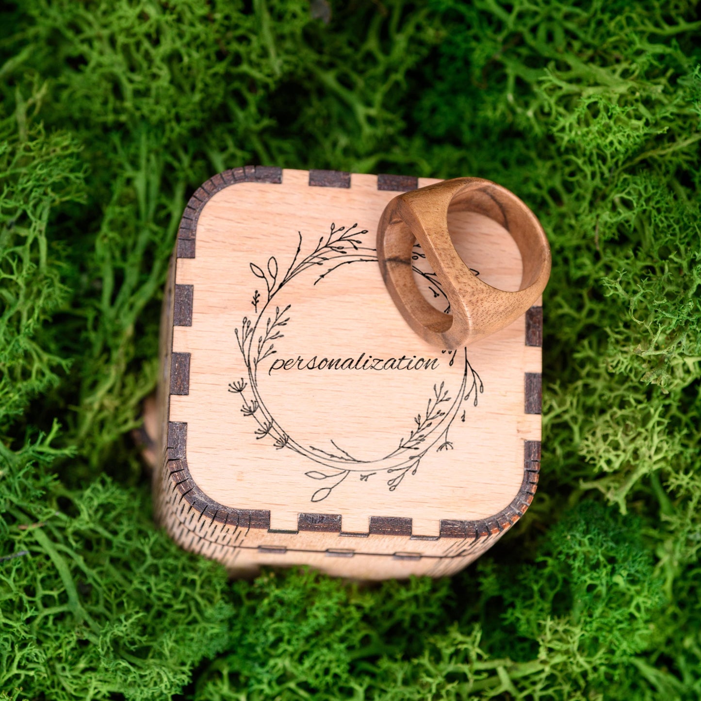 Handmade wood ring inside a custom wooden box, ready for gifting.