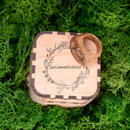 Handmade wood ring inside a custom wooden box, ready for gifting.