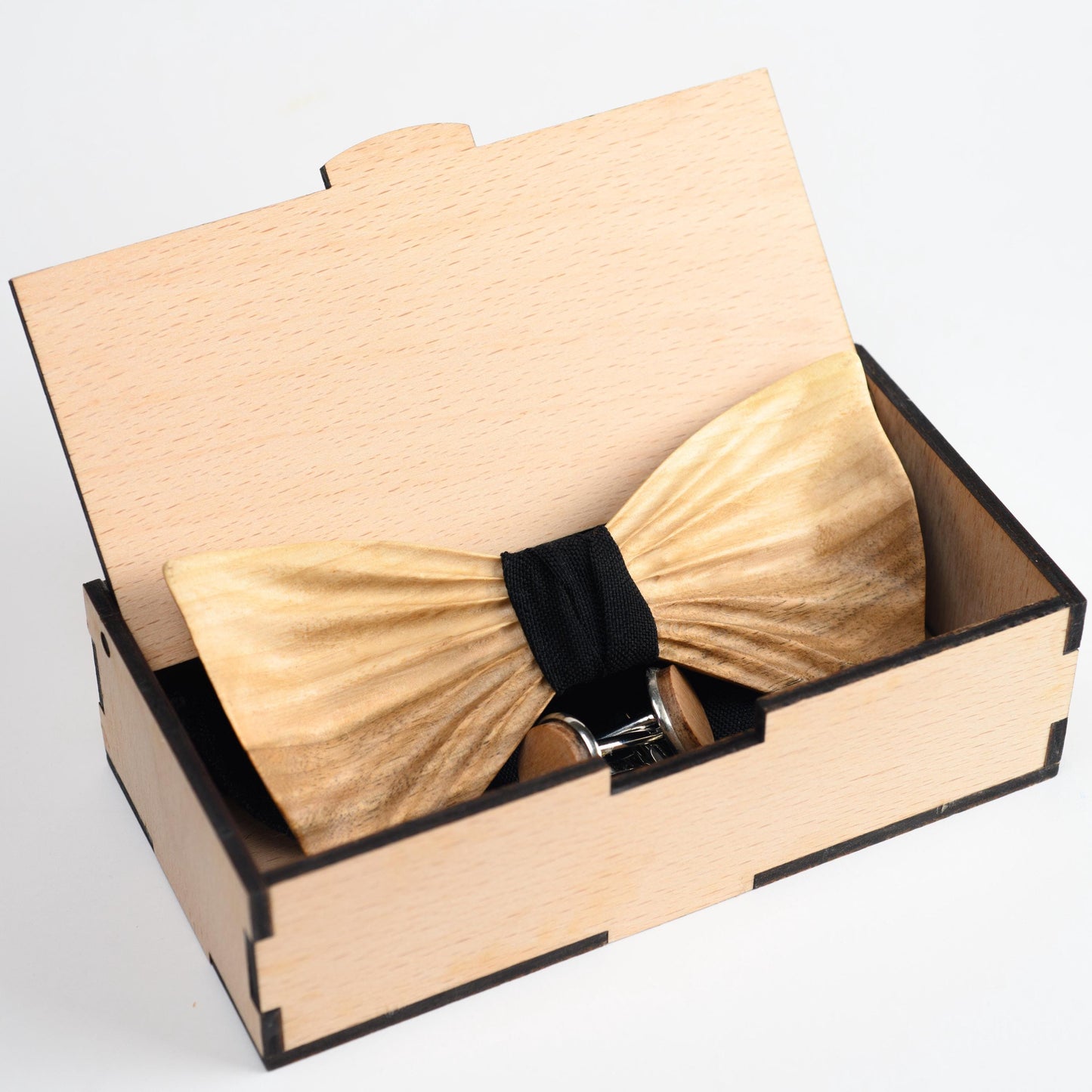 Groomsmen bow tie set with personalized cufflinks and a pocket square in a sleek presentation box.