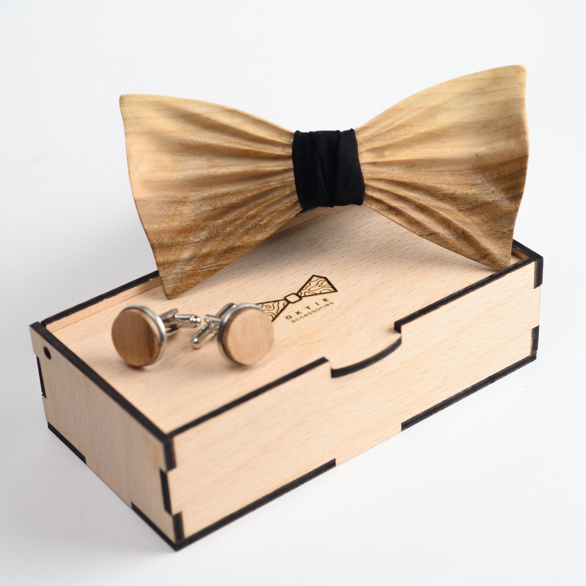 A stylish wooden bowtie for men, paired with a neatly folded pocket square in a rich fabric color.