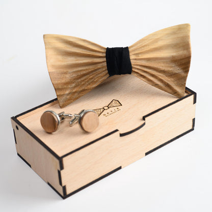A stylish wooden bowtie for men, paired with a neatly folded pocket square in a rich fabric color.