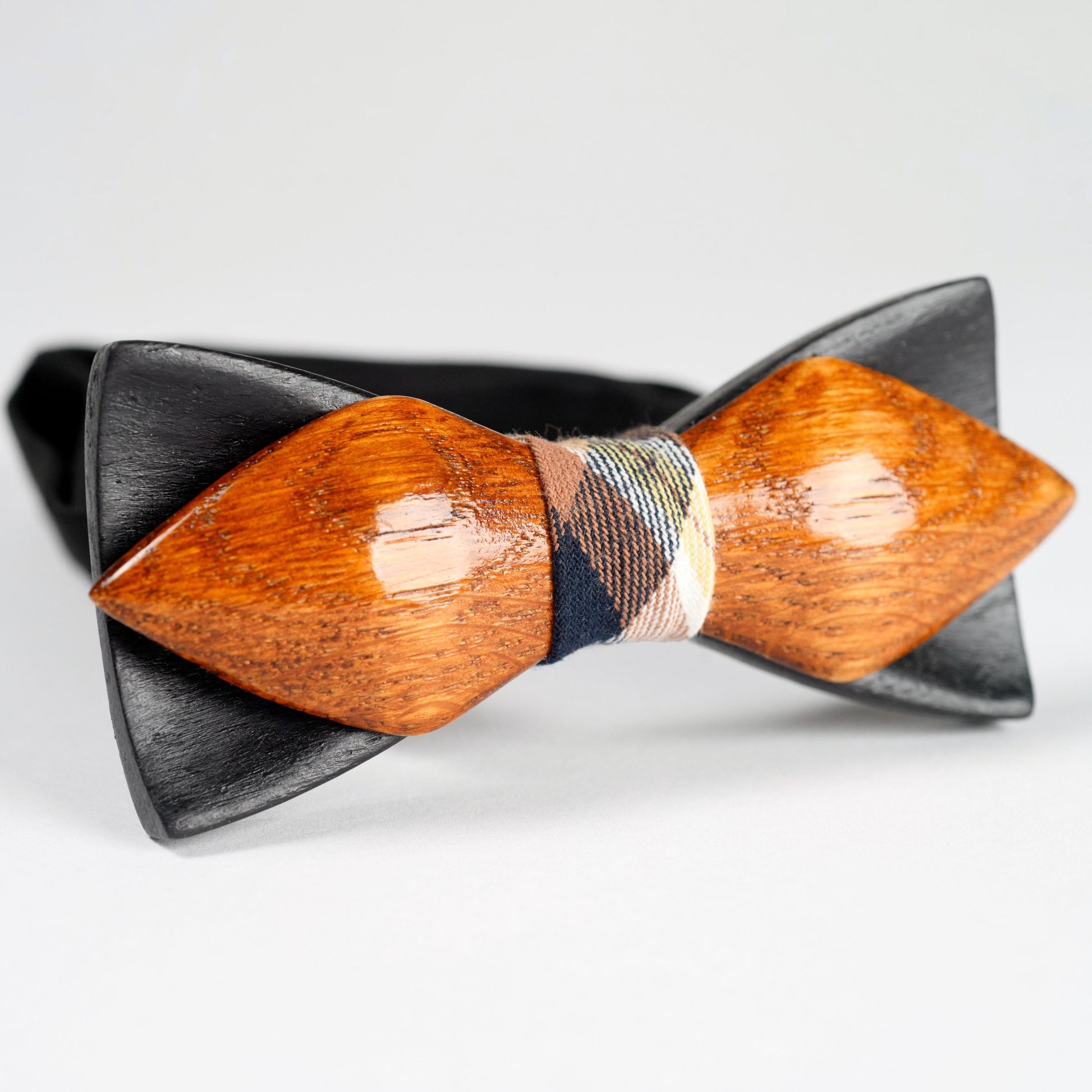 Handmade wooden bow tie in a classic shape, crafted from oak wood in black and brown colors.