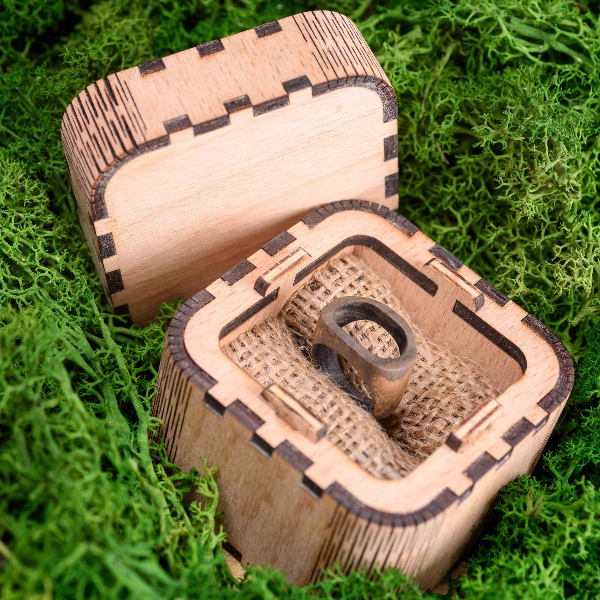 Handmade wood ring inside a custom wooden box, ready for gifting.
