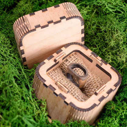 Handmade wood ring inside a custom wooden box, ready for gifting.