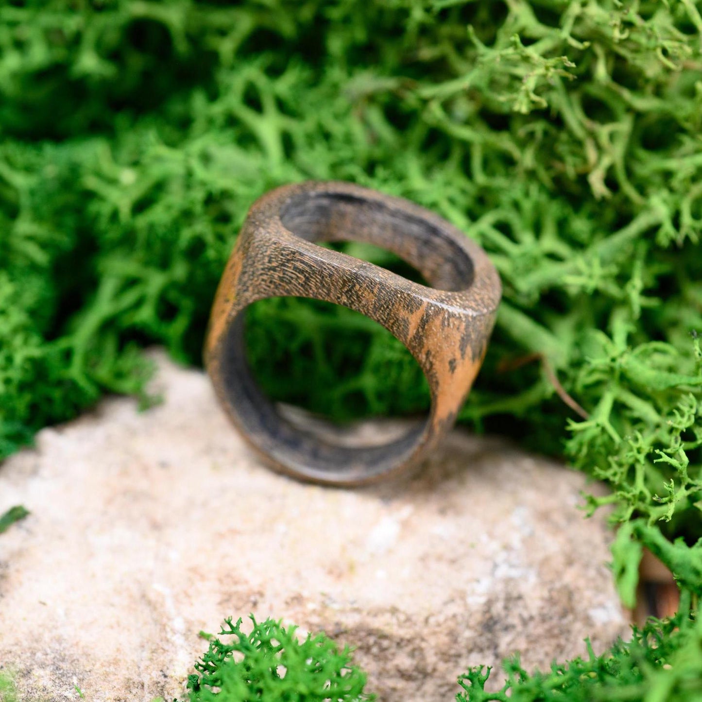 Handmade walnut wood ring with a smooth finish