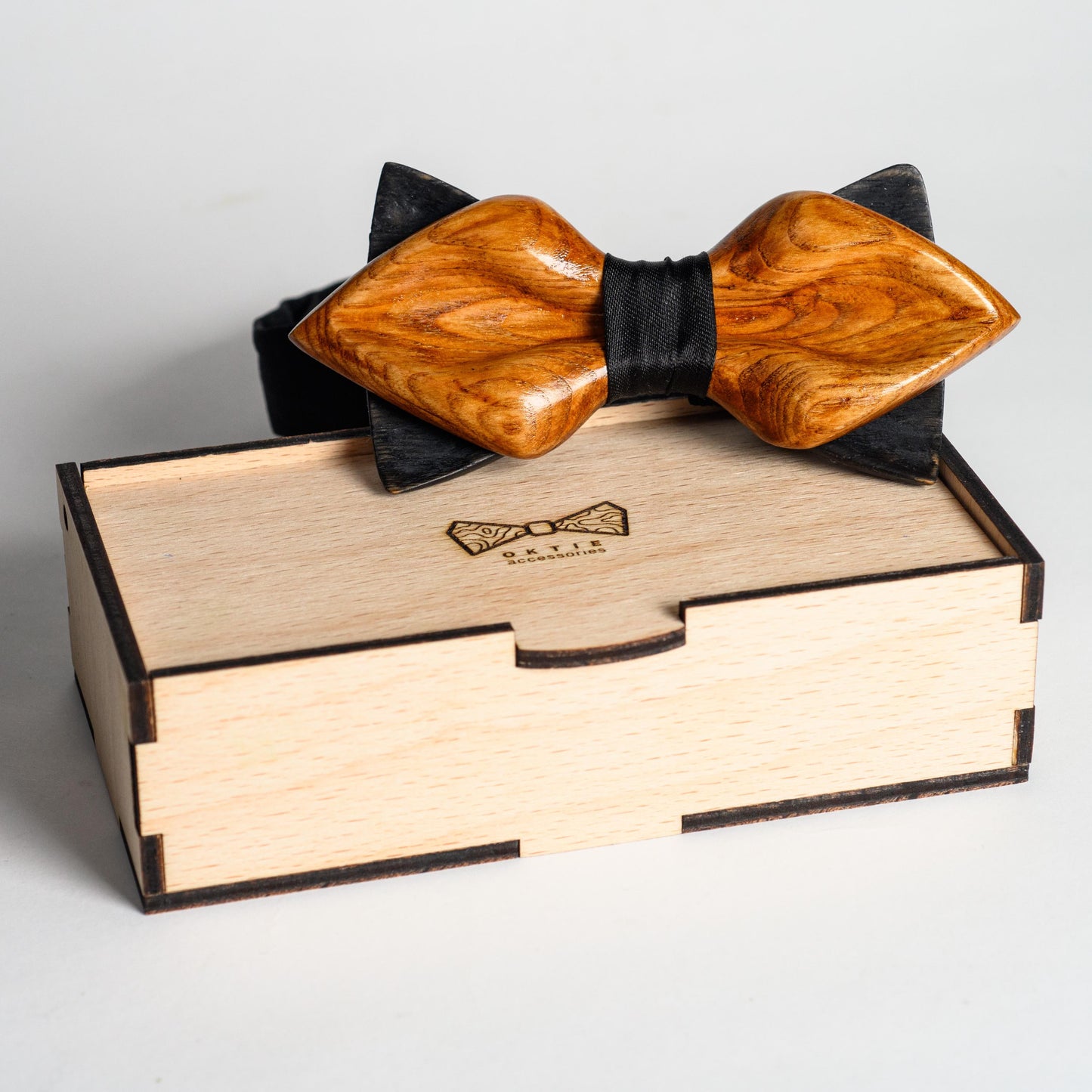 Rustic wedding accessory featuring handcrafted oak and a dark adjustable strap.