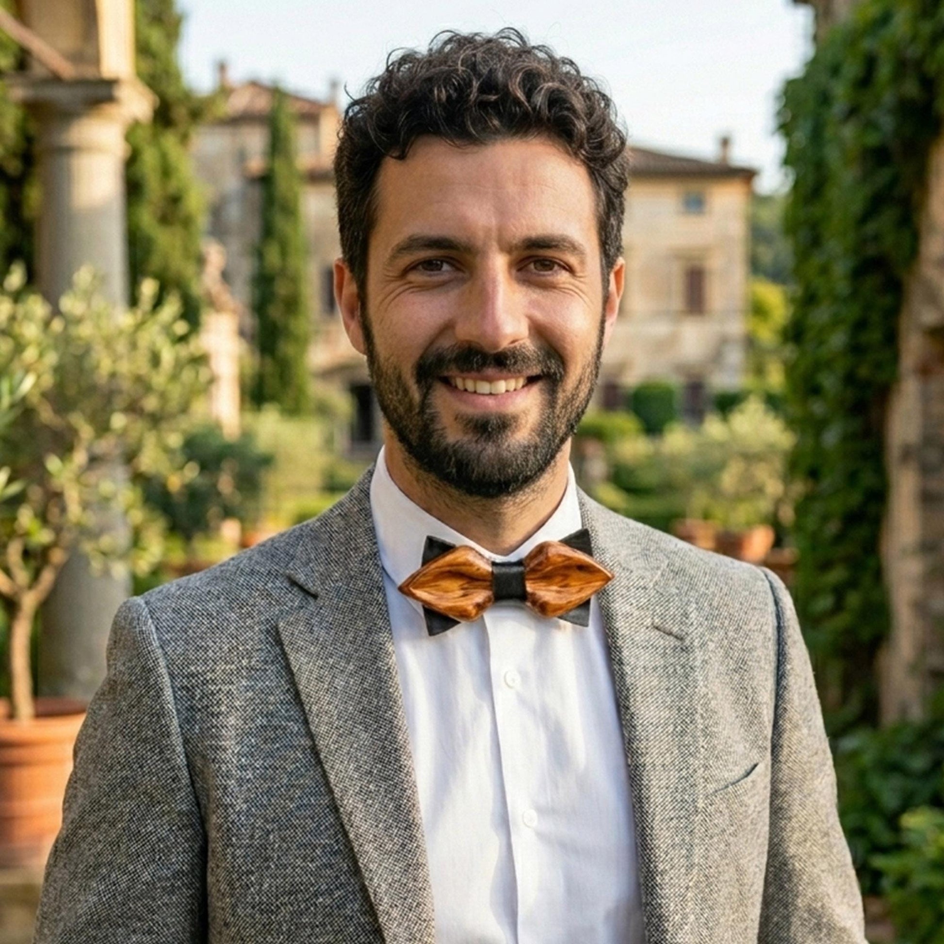 Groom gift idea: a polished oak bow tie with a classic symmetrical shape.